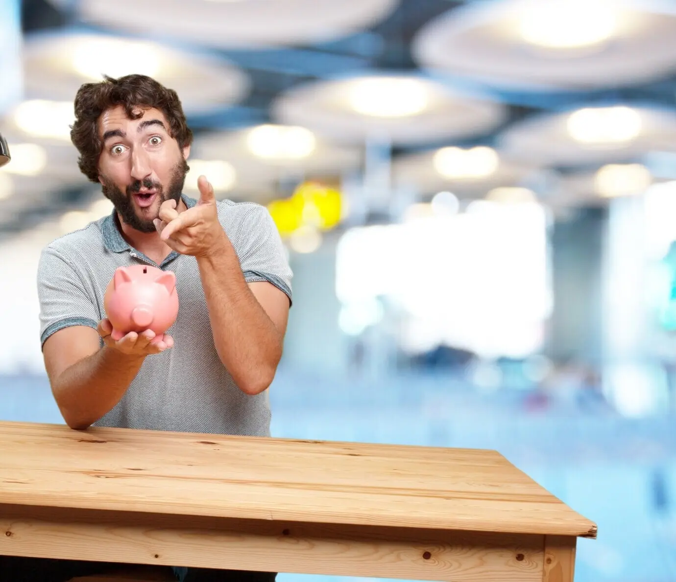 A crazy young man at a table with a happy expression.